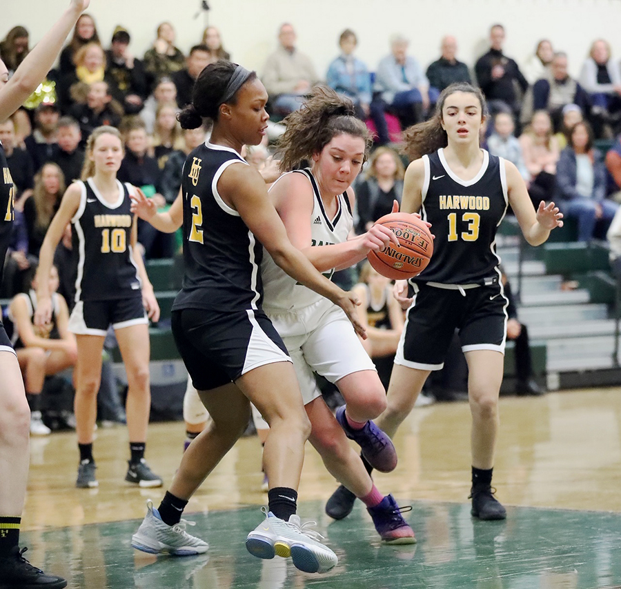 Ella Gannon defends Stowe forward at recent game.  Harwood won 51-10